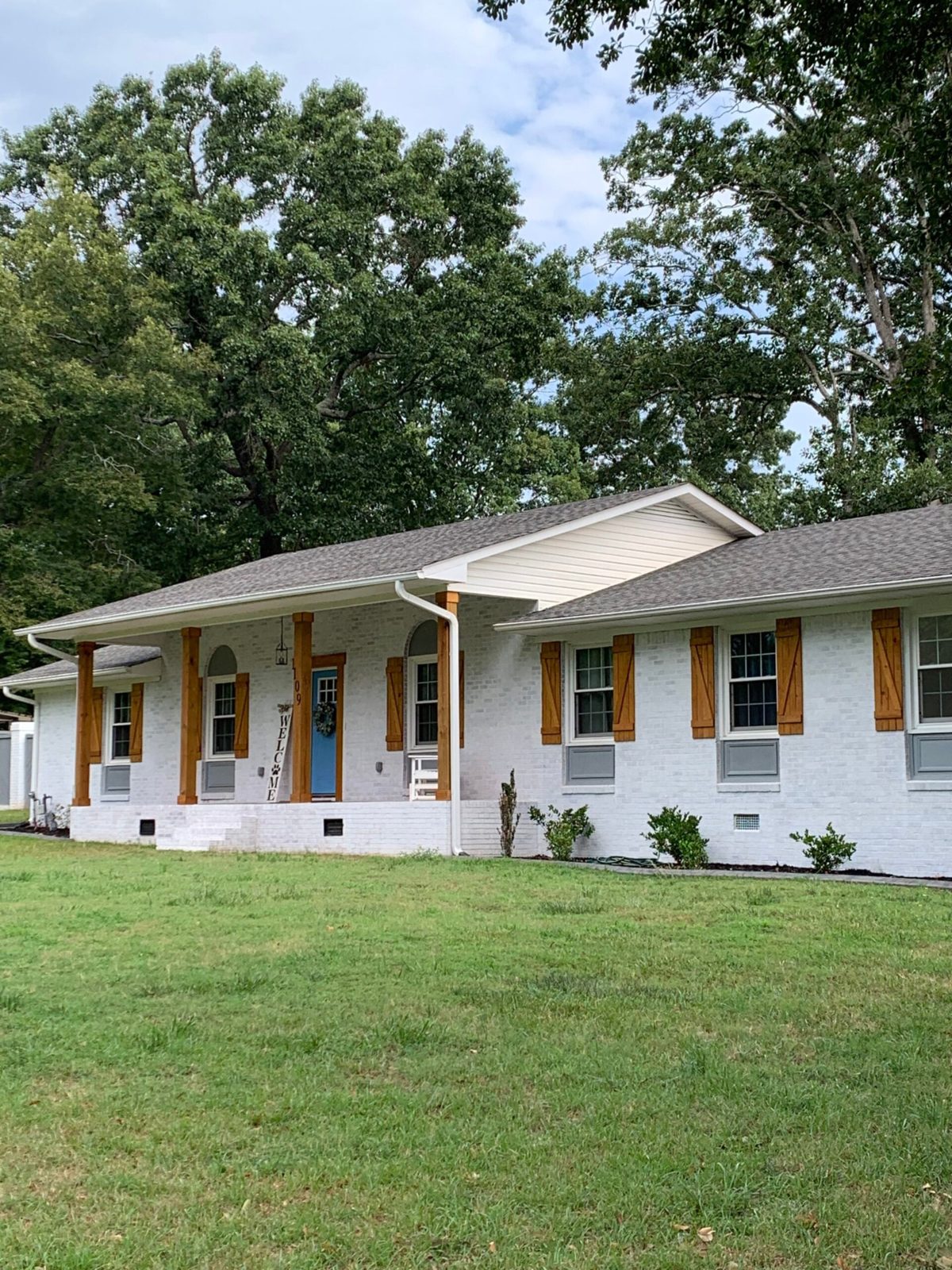 White brick ranch home in Upstate SC with new white replacement windows
